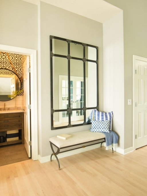 A contemporary home entry hallway foyer with bathroom and interior front door.